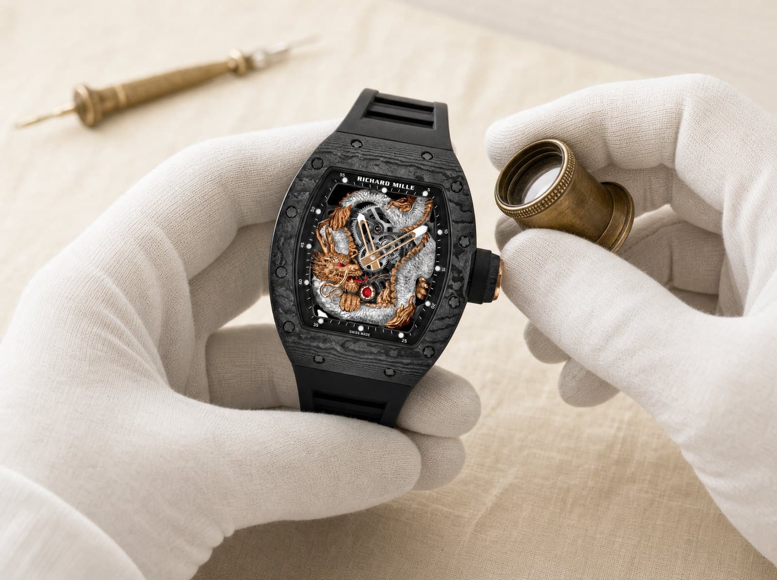 A specialist examining a timepiece under the loupe