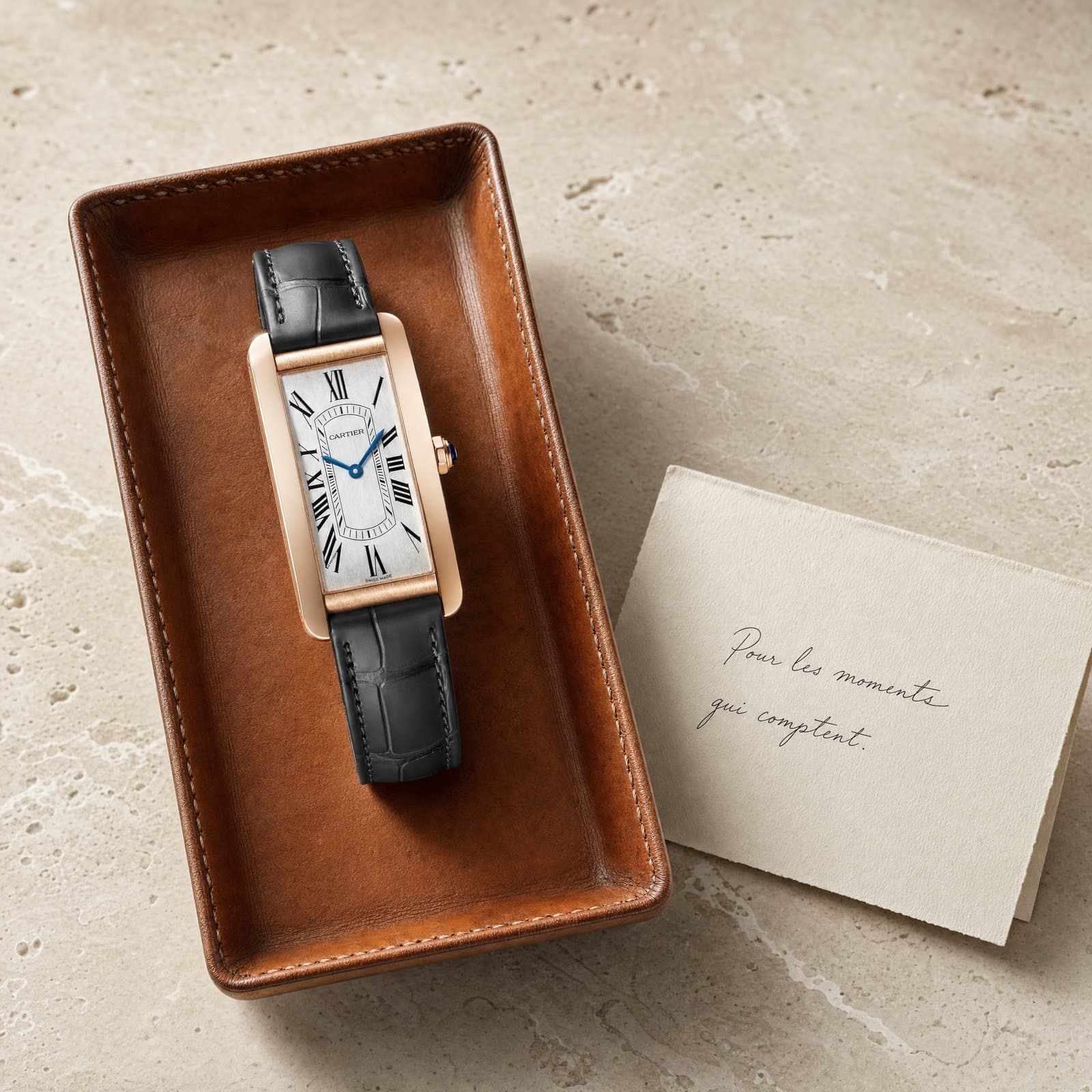 A Cartier presented on the concierge tray