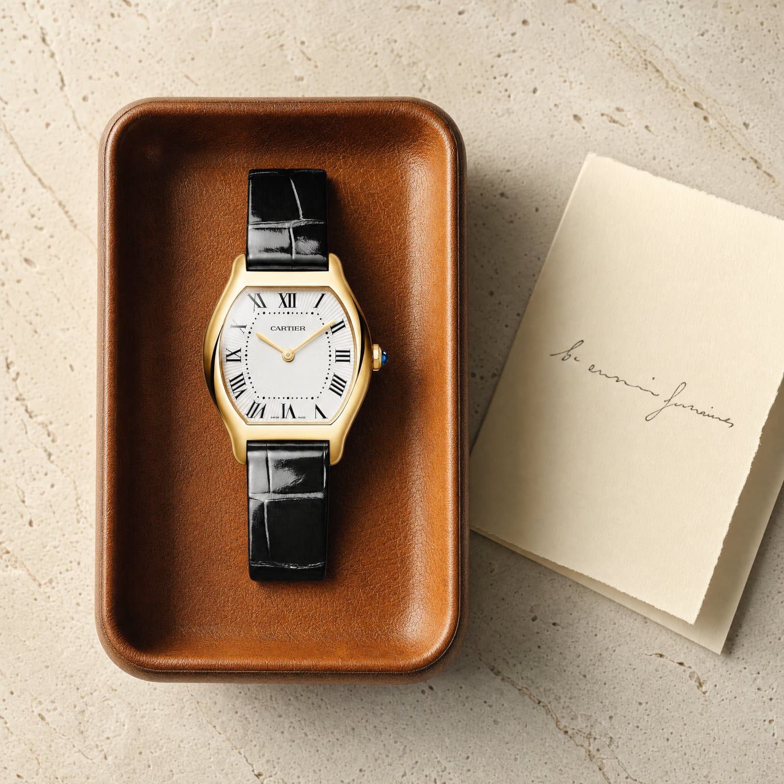 Cartier Tortue references together on travertine