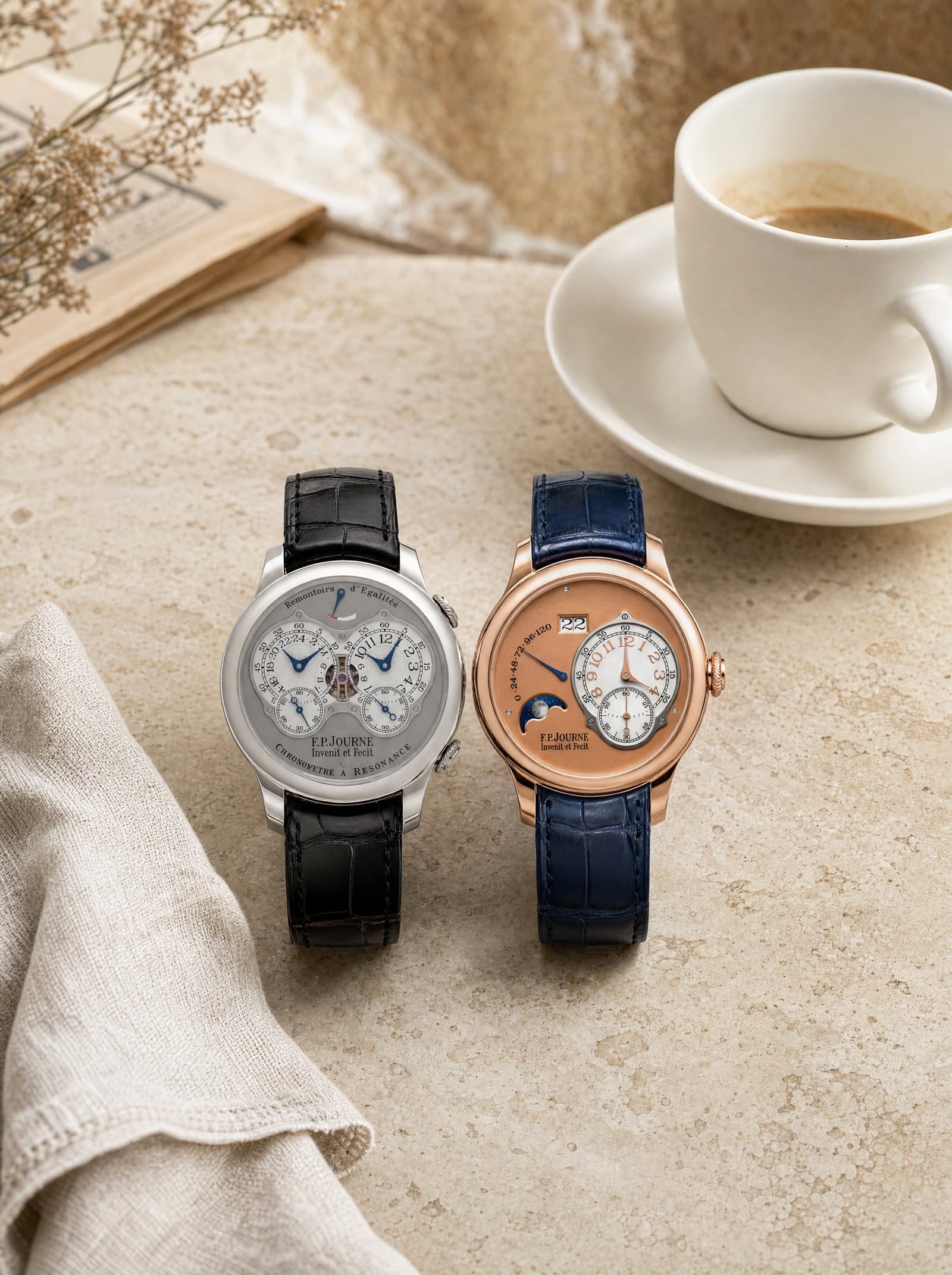A Chronomètre and an Octa resting together on a travertine café table