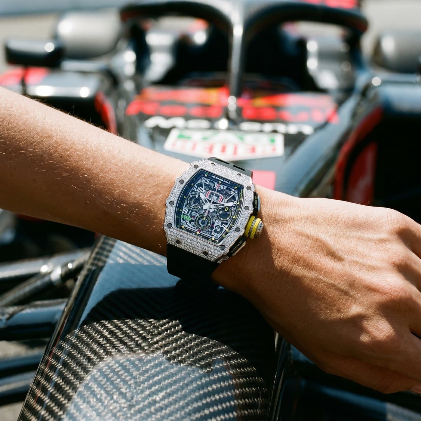 A Richard Mille RM 11-03 on the wrist, paddock