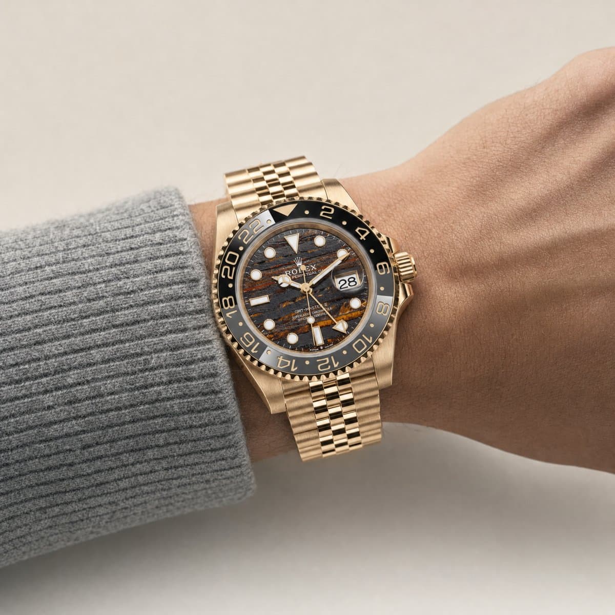 Rolex GMT-Master II 126718GRNR Yellow Gold Tiger Iron Dial Jubilee (2025) — worn